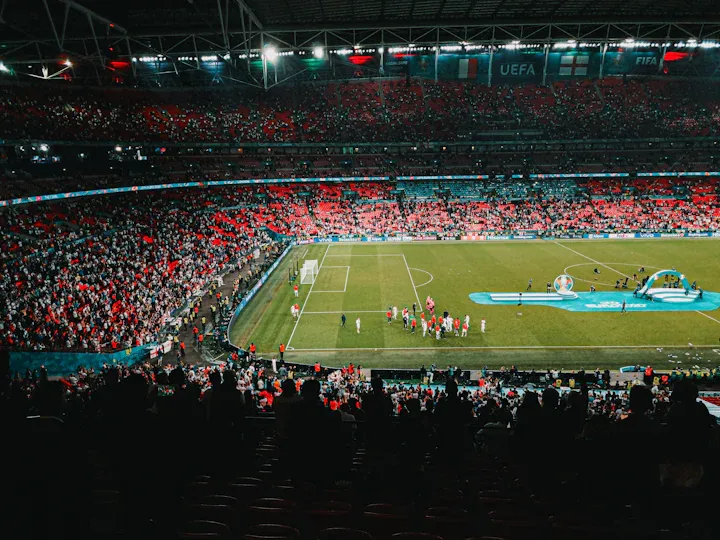 Football supporters watching a match from the stands